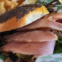 Smoked Turkey · Smoked turkey, thinly sliced, and served cold on choice of bread with sliced tomato & mixed ...