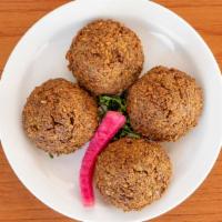 Falafel · Fresh ground chickpeas with herbs and spices, fried until golden brown and served with speci...