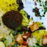 Sahara Entrée Plate · Each plate comes with basmati rice, falafel, hummus, fattoush salad, dolmas and fresh pita.