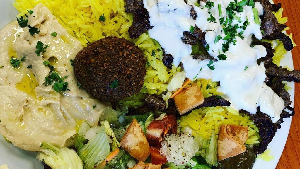 Sahara Entrée Plate · Each plate comes with basmati rice, falafel, hummus, fattoush salad, dolmas and fresh pita.