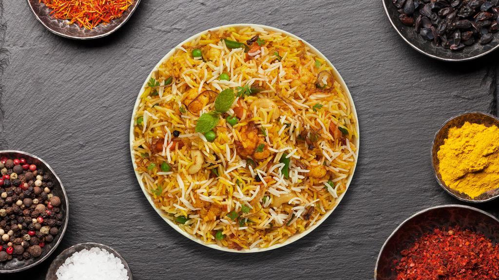 Vegetable Biryani For Days · Spiced seasoned vegetables cooked with Indian spices and basmati rice. Served with house raita.