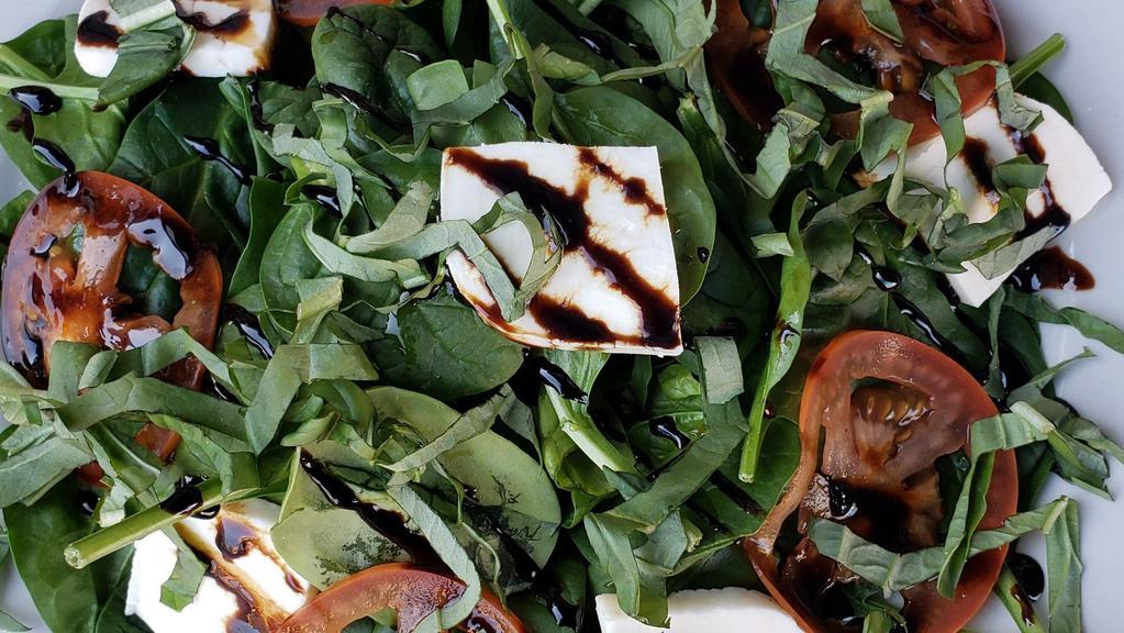 Caprese Salad. · Tomatoes sliced with fresh mozzarella, fresh basil, fresh spinach, drizzled with with balsamic glaze drizzle