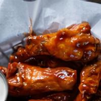 Bone-In Jumbo Hot Wings · Bone in jumbo wings, baked then fried, smothered with your favorite wing sauce!