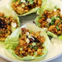 Chicken Lettuce Wrap 4Pc 鸡肉生菜卷 · Diced chicken thigh stir-fried with house soy sauce, wrapped with lettuce.
