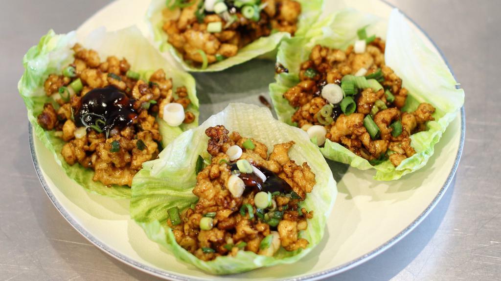 Chicken Lettuce Wrap 4Pc 鸡肉生菜卷 · Diced chicken thigh stir-fried with house soy sauce, wrapped with lettuce.