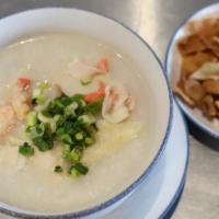 Seafood Porridge 海鲜粥 · White rice oatmeal with shrimp, calamari, and fish. Come with crispy crackers.