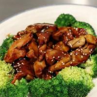 Teriyaki Chicken 照烧鸡排 · Teriyaki sauce stir-fried sliced chicken with steamed broccoli.