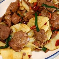 Yam Beef 山药牛肉 · Beef tenderloin slices stir-fried with white yam slices and chef's sauce. Tinted with Goji b...