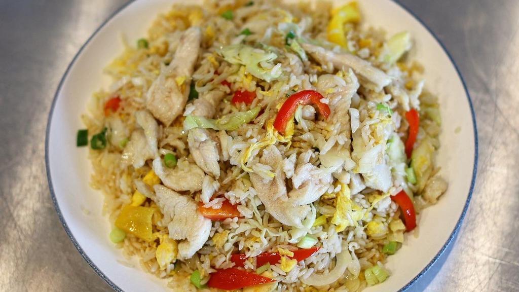 Chicken Fried Rice 鸡肉炒饭 · White rice stir-fried with chicken slices, veggies, and egg.