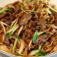 Beef Chow-Fun 牛肉炒河粉 · Wide rice noodle stir-fried with beef tenderloin slices and veggies.
