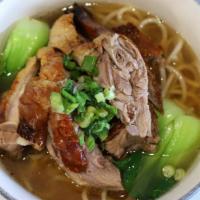 Roast Duck Soup Noodle 烧鸭粉面 · Roast duck chops glazed with soybean sauce and comes with noodle of choice.