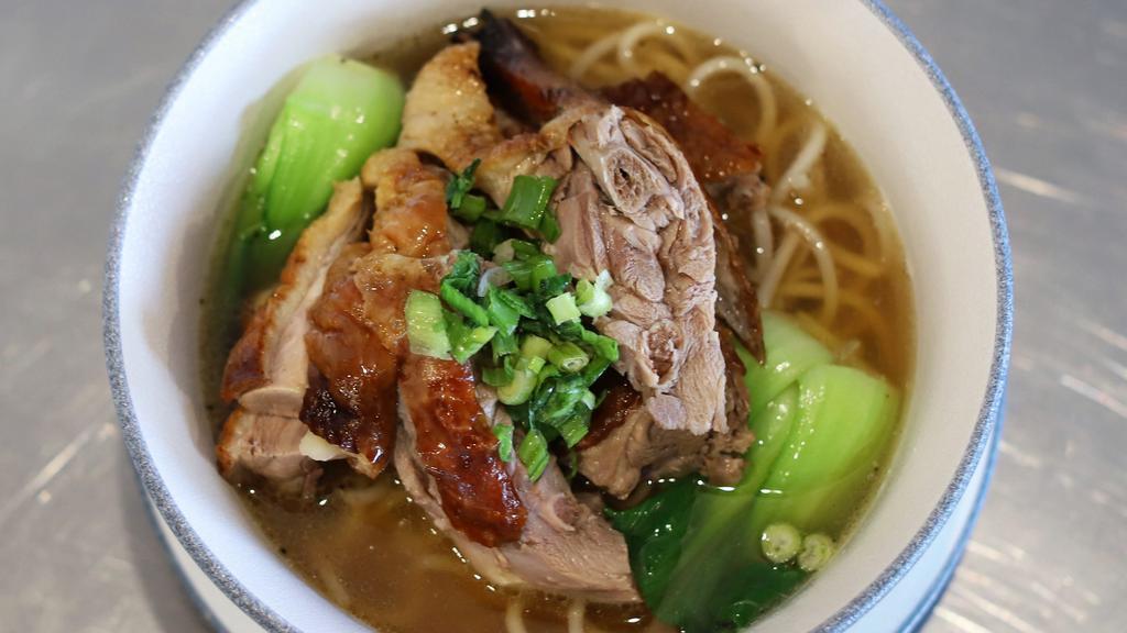 Roast Duck Soup Noodle 烧鸭粉面 · Roast duck chops glazed with soybean sauce and comes with noodle of choice.