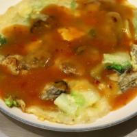 Oyster Omelet 蚵仔煎 · Taiwan special omelet stir-fried with fresh shucked oysters and Chinese cabbage, topped with...