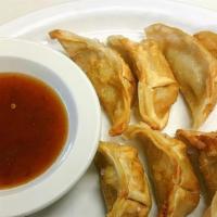 Pot Stickers · (8 pieces) deep-fried chicken and vegetable dumplings, served with a side of sweet and sour ...