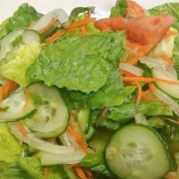 Yum Salad · Gluten free. Fresh romaine lettuce, cucumber, tomato, carrots, onion, and cilantro, topped w...
