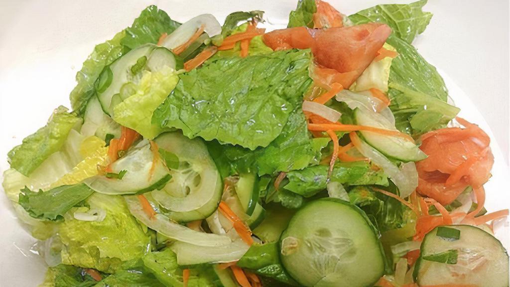 Yum Salad · Gluten free. Fresh romaine lettuce, cucumber, tomato, carrots, onion, and cilantro, topped with our special house vinaigrette dressing. Dressing contains fish sauce.