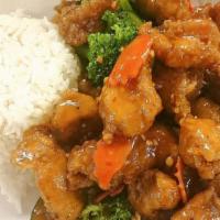 Orange Chicken · Fried and battered, tossed in our delicious homemade orange sauce with zucchini, carrots, br...
