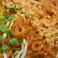 Phad Thai · Pan-fried noodles with egg and sprouts in a sweet red sauce, topped with shredded cabbage, s...