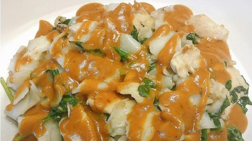 Swimming Rama Noodles · Pan-fried fresh wide rice noodles with garlic and spinach, topped off with our creamy house peanut sauce.
