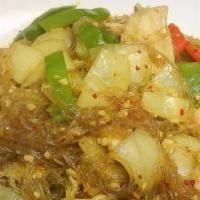 Spicy Bean Thread Noodles · Pan-fried thin vermicelli noodles with egg, cabbage, carrots, onion and sprouts in yellow cu...