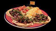 Tacos Al Carbon · Grilled beef or chicken on corn tortillas. Served with cheese, lettuce and pico de gallo. Se...