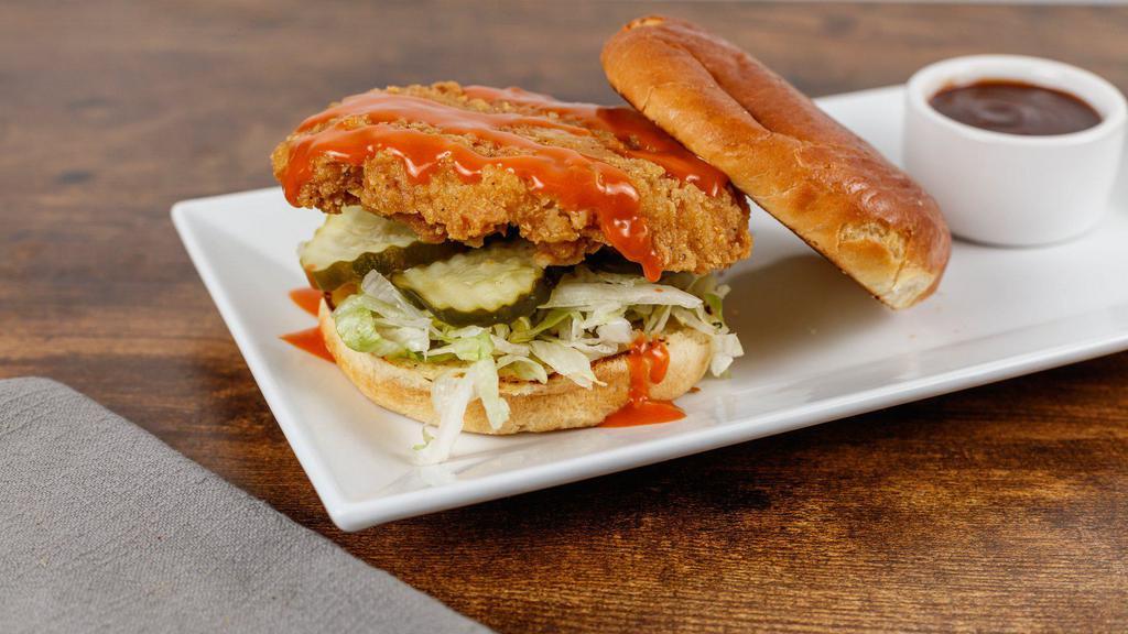 The Hot Chick Sandwich · Crispy fried chicken breast, spicy wing sauce, lettuce, and dill pickles on butter grilled roll.
