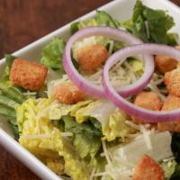 Side Caesar Salad · Romaine, croutons, parmesan, red onions and Caesar dressing.