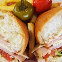 Turkey And Swiss · Freshly sliced Turkey served on a mini loaf with mayo, lettuce and tomato. Your choice of Gr...