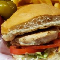 Grilled Chicken Sandwich · Grilled to perfection, served on our fresh baked bun with mayo, lettuce and tomato.