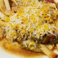 Green Chile Chz Fries · Our premium fry smothered in our house made green chili topped with shredded cheese.