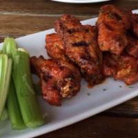 Wings · Fried, sauced and grilled. Choose: dry or traditional, served with celery and jicama.