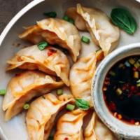 Potstickers (6 Pc) · These pork potstickers are pan fried to create an irresistible contrast between the top tend...