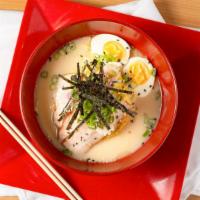 Signature Tonkotsu Ramen · Original tonkotsu broth enhanced with chashu simmered pork, boiled egg, fish cake, green oni...