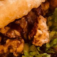 Chicken Karaage Sushi Burger · Japanese style deep fried chicken with lettuce, savory chef signature sauce squished between...