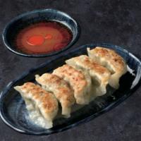 [Gyoza] · Santouka original pan fried dumplings filled with minced pork, chicken and cabbage.