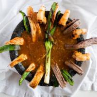 Molcajete · New. A semi-spicy Mexican stew made with steak, shrimp, and chicken, combined with poblano p...