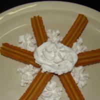 Churros · Six delicious Mexican pastries with cinnamon and sugar. Topped with honey and whipped cream.