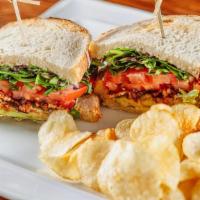 Blt · Bacon, lettuce, tomato sandwich between two pieces of toasted sourdough bread with mayo and ...