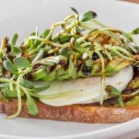 Avocado Toast With Microgreens · Avocado toast top with in house grown nutrient-rich sunflower microgreen and egg plus balsam...