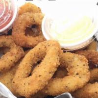 Fried Calamari · All natural squid hand dusted with seasoned coating served with sweet chili sauce.