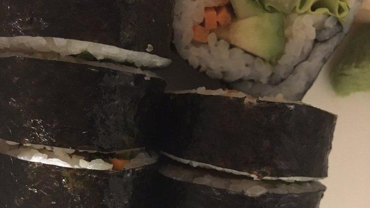Vegan Roll · Vegan, spicy. Carrot, inari, daikon, shaved cabbage, cucumber, avocado, green leaf lettuce with sweet chili sauce.