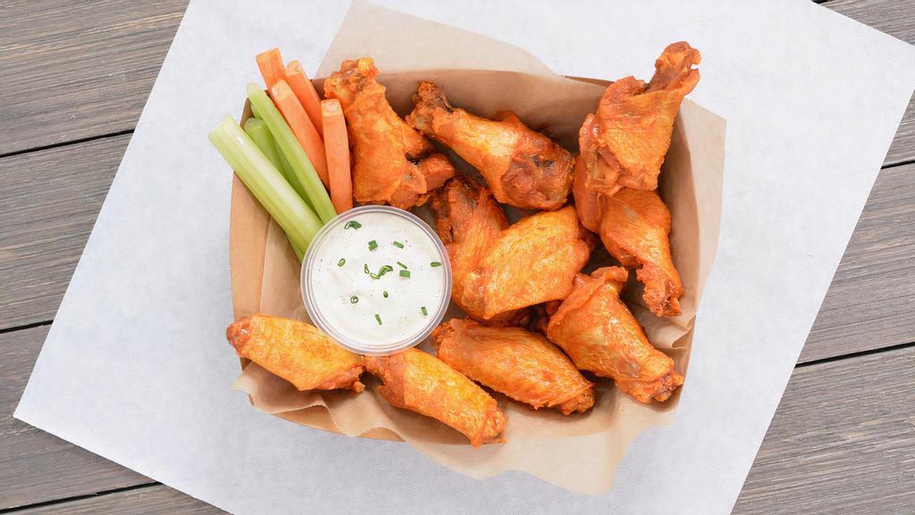 10 Classic Bone-In Wings · 10 Classic bone-in chicken wings tossed in up to 2 wing flavors and served with fresh carrot & celery sticks and homemade buttermilk ranch or blue cheese dressing.