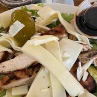 Grilled Chicken Salad · Grilled chicken over a bed of lettuce and tomato with cucumber, Provolone cheese and your ch...