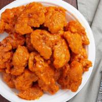 Buffalo Boneless Chicken Wings · Boneless, chicken breast, tossed with hot sauce for a spicy chicken wing.