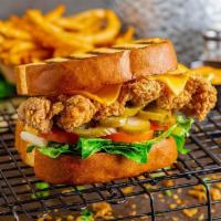 Clucks N' Toast - Sandwich · Crispy, hand-breaded, whole chicken thigh between grilled, thick cut, Texas toast. Served wi...