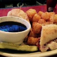 Irish Dip · Thin slices of our house-braised corned beef and provolone cheese served on a grilled baguet...