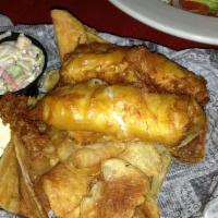 Fish & Chips · Alaskan cod hand-dipped in beer batter for a light and crispy finish served with pub chips, ...