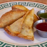 Vegetable Samosas · Potato and carrot filled pastry. Served 3 pcs to an order