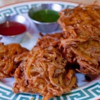 Onion Baji · Chick pea batter fried onion fritters. Served 5 pcs to an order