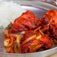 Chicken Tandoori Special · Half chicken on the bone. Baked in the tandoori oven and sauteed in a light tomato sauce wit...
